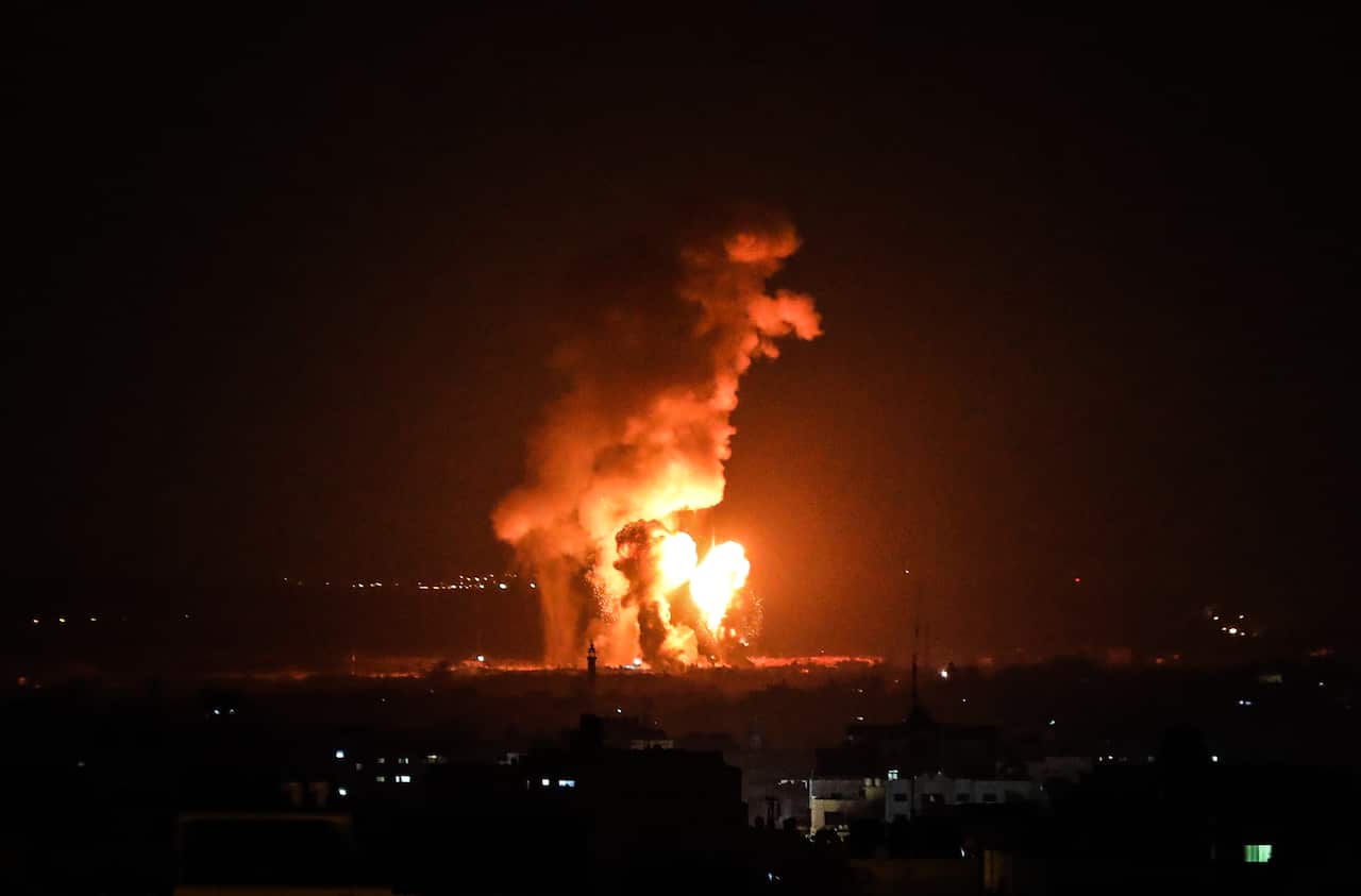Smoke and flames rise after Israeli fighter jets hit Gaza City.