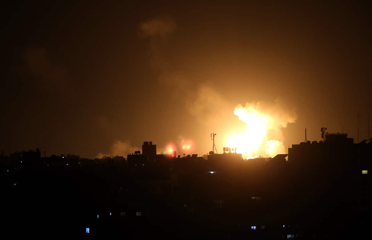 Smoke rises after Israeli fighter jets hit Gaza City.