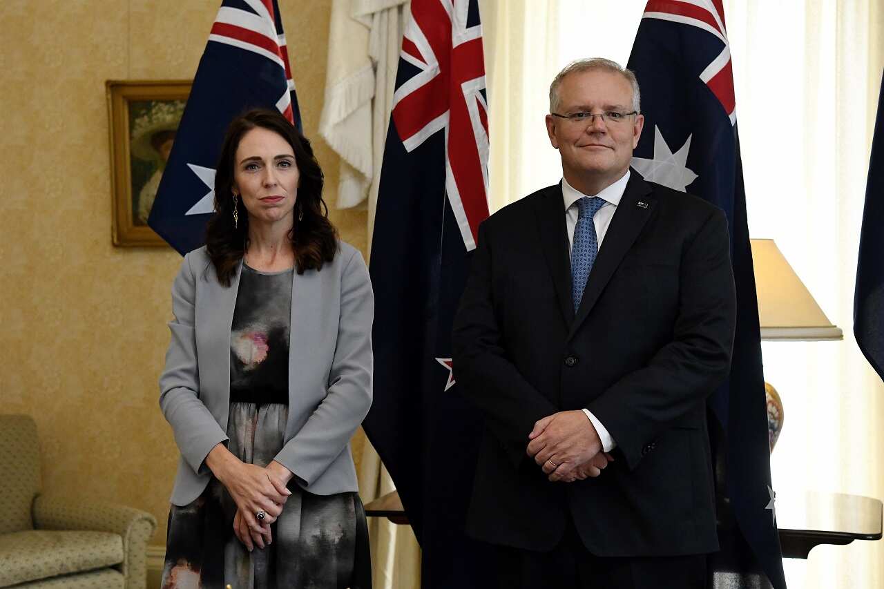 New Zealand Prime Minister Jacinda Ardern stands with Australian Prime Minister Scott Morrison in 2020.