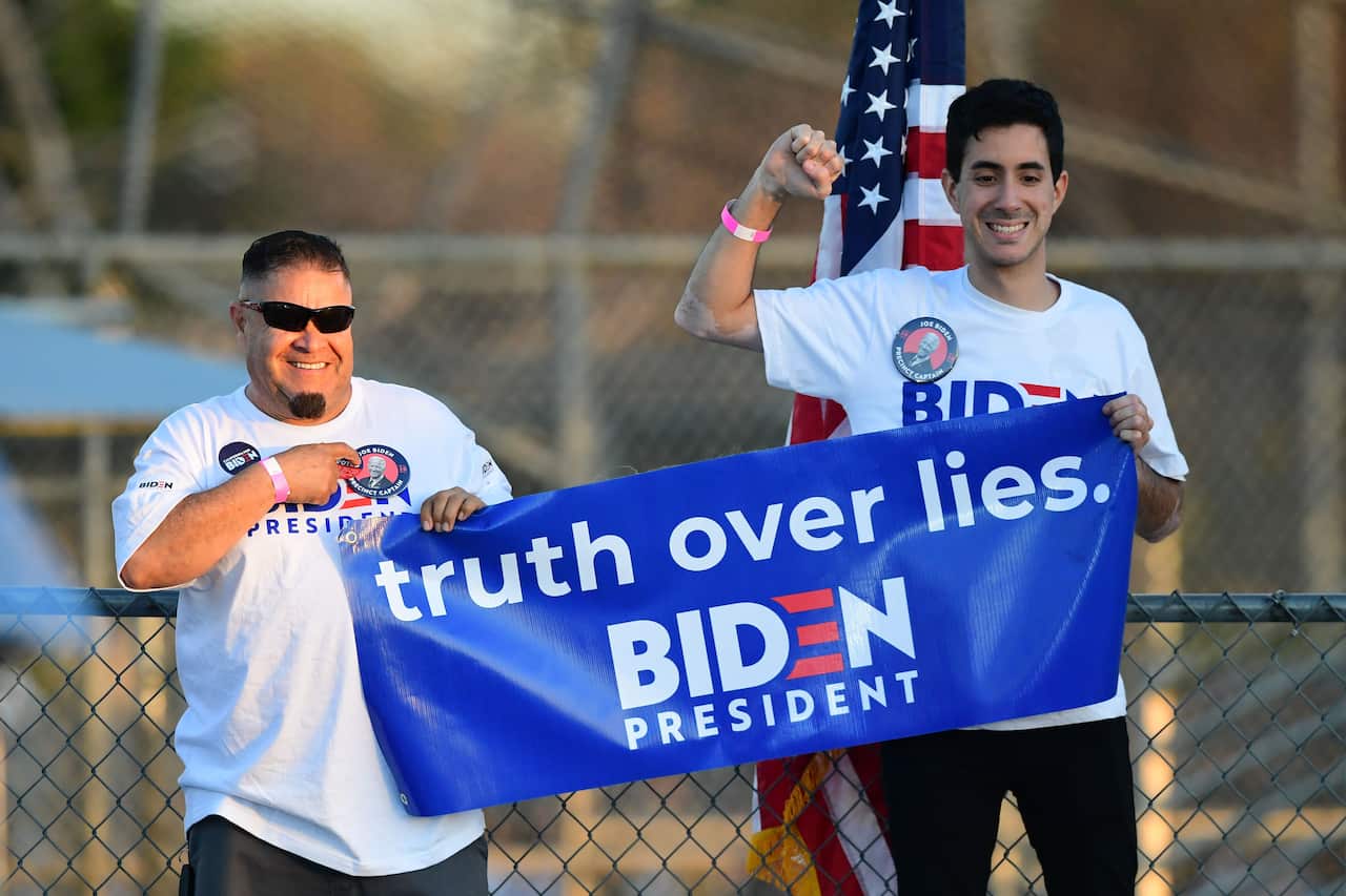 Supporters of Democratic presidential hopeful former Vice President Joe Biden attend a Super Tuesday event in Los Angeles.