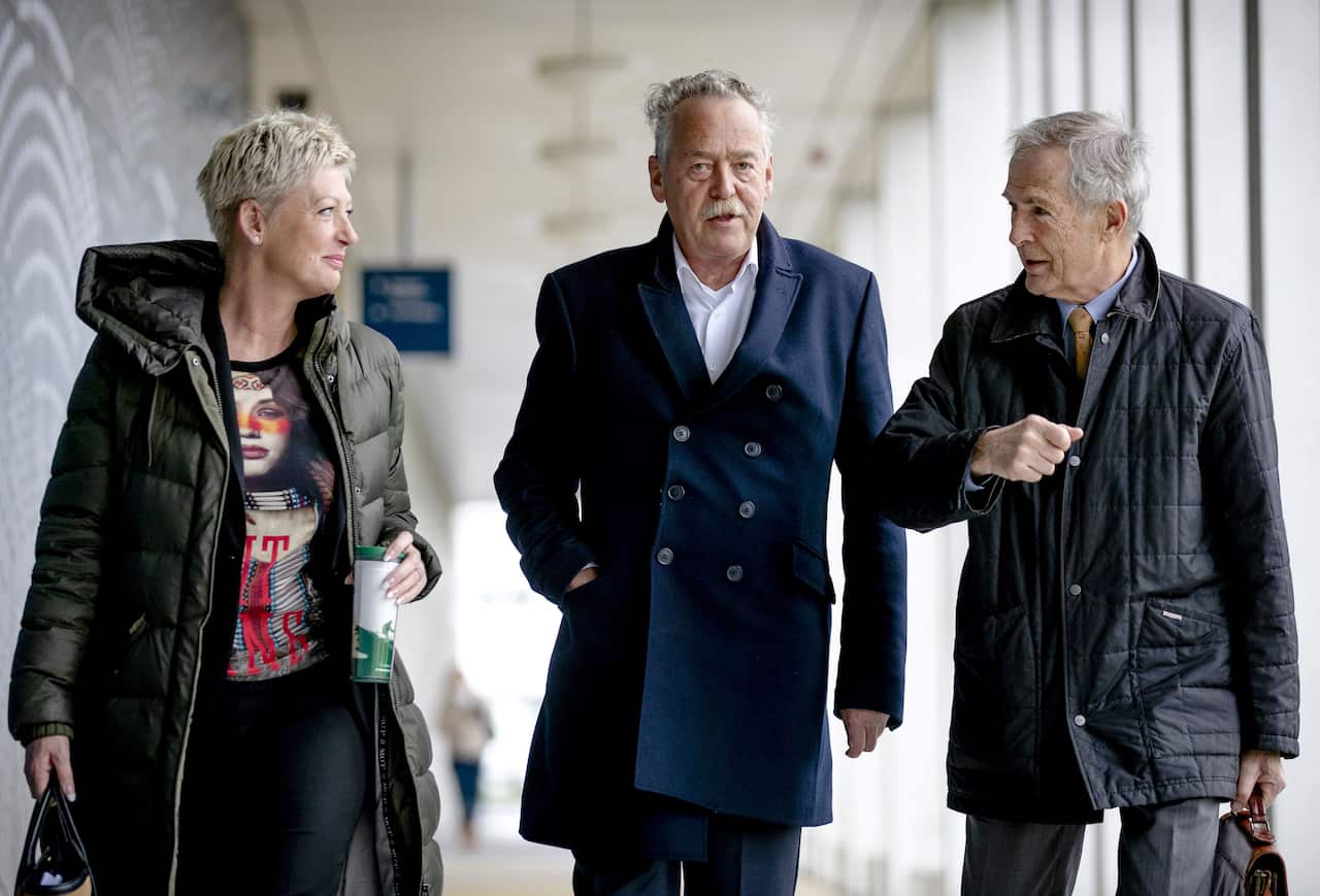 Victim relatives (from L to R) Ria van der Steen, chairman of the MH17 Airplane Disaster Foundation Piet Ploeg, Anton Kotte arrive at court.