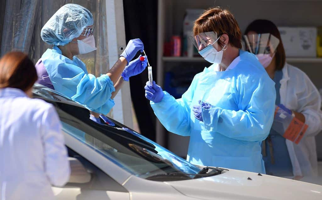 Medical workers at a drive-thru testing facility in San Francisco, California.