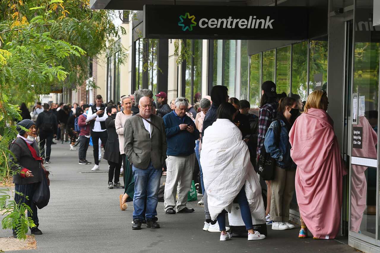 Hundreds of people queue outside a Centrelink in Melbourne amid the coronavirus pandemic.