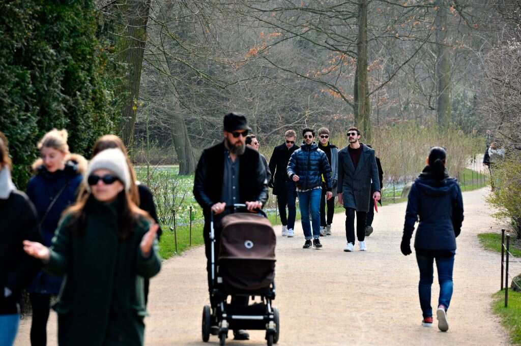 People exercising in parks in Copenhagen, Denmark after coronavirus restrictions are were eased.