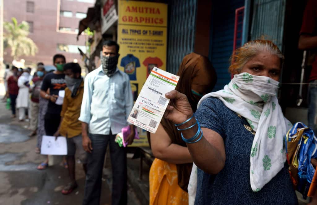 Residents of Dharavi lineup at rationing office for the food items