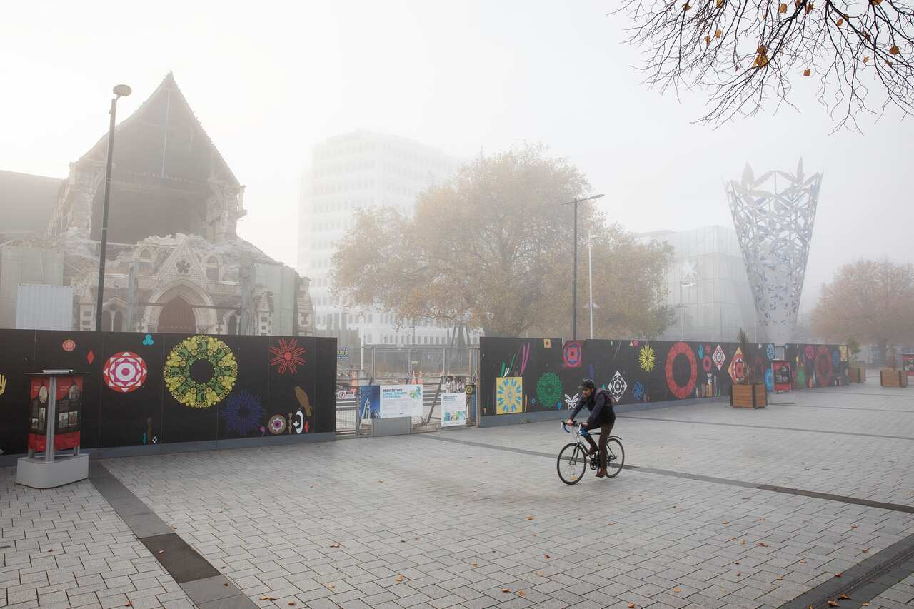 A man rides past the usually crowded Cathedral Square during the COVID-19 alert level 4 lockdown in Christchurch, New Zealand.