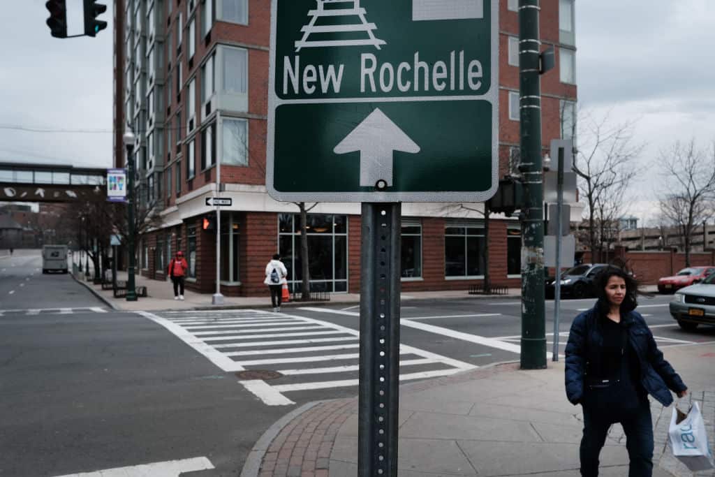 People walk through downtown on 10 March, 2020 in New Rochelle, New York. 