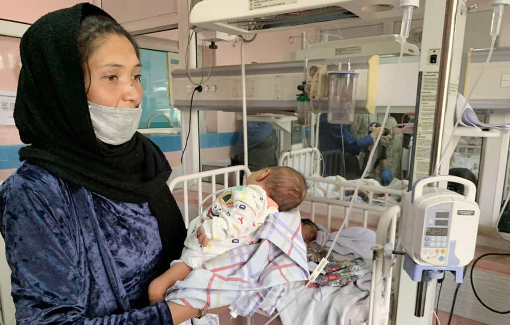 Newborn infants receive medical care in Kabul