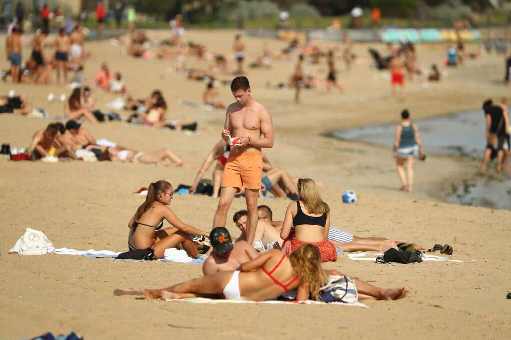 People pack onto St Kilda beach on March 27 despite social distancing rules