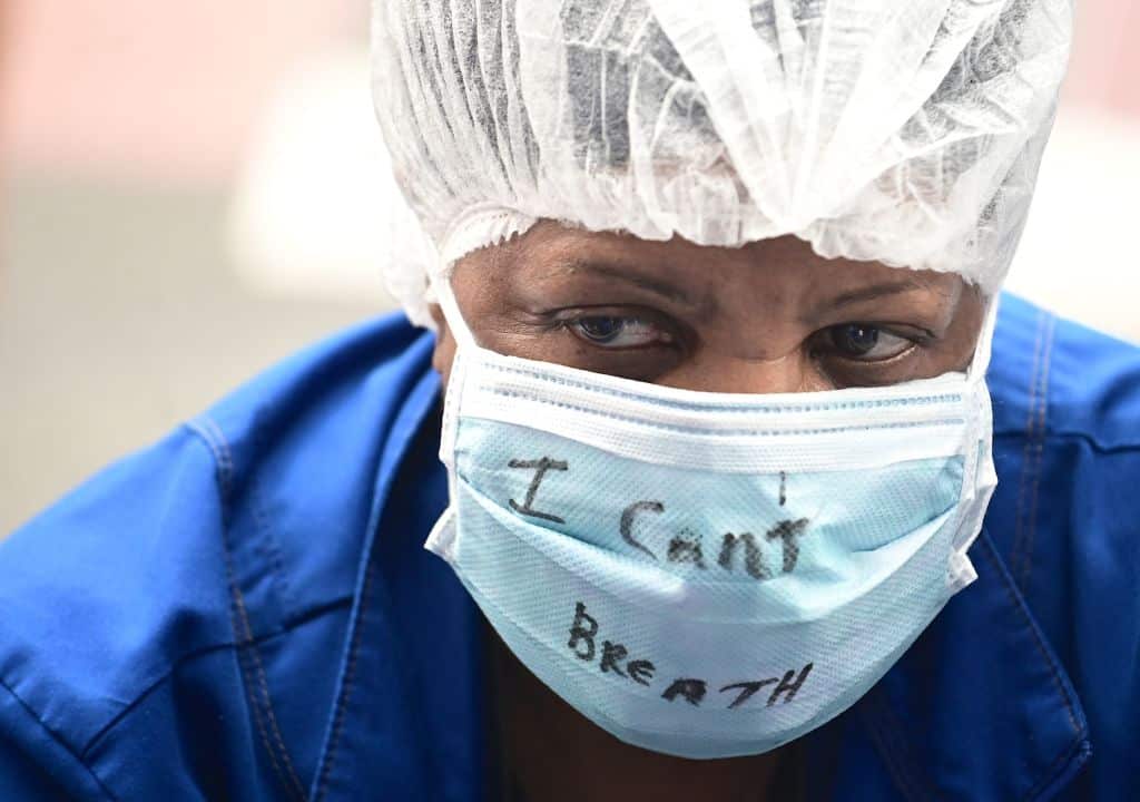 Nurses and healthcare workers attend a Black Lives Matter rally in front of Bellevue Hospital on June 4, 2020, in New York City. (Photo by Johannes EISELE / AFP) (Photo by JOHANNES EISELE/AFP via Getty Images)