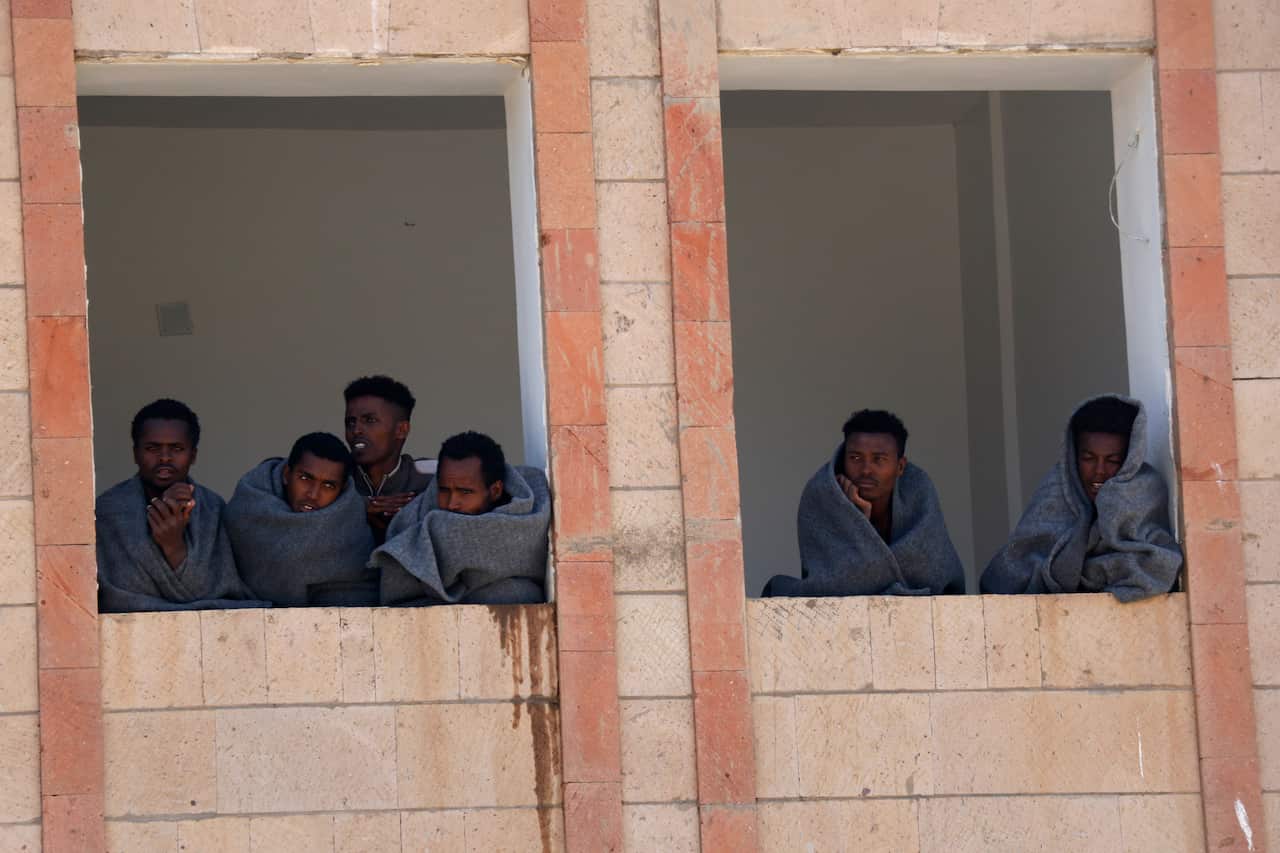 Ethiopian migrants are seen inside a building while undergoing quarantine on April 05, 2020 in Dhamar governorate, Yemen.