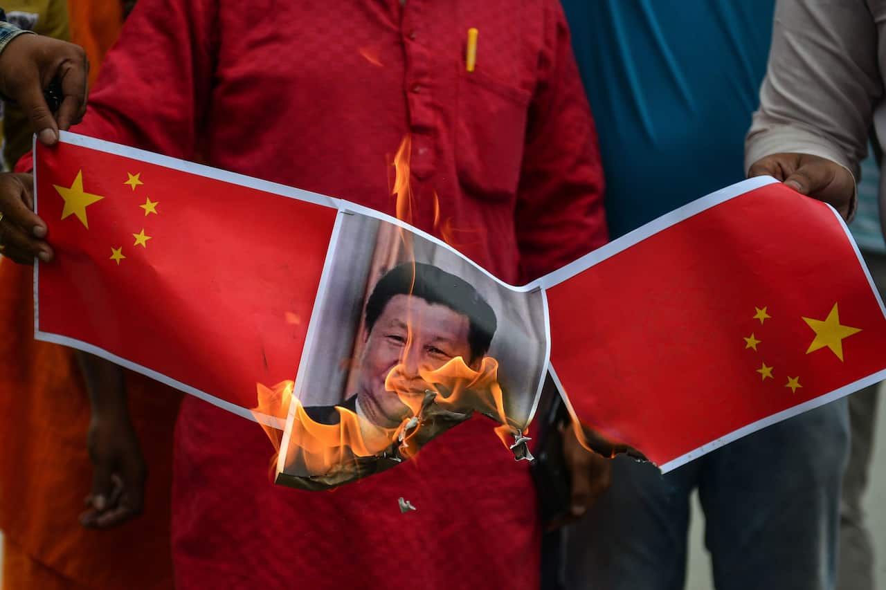 Bharatiya Janata Party (BJP) supporters burn posters and effigy of Chinese President Xi Jinping during an anti-China protest in India, June 2020.