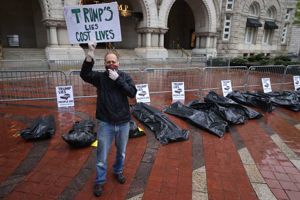 Protesters deliver fake body bags to the Trump International Hotel in Washington, D.C.
