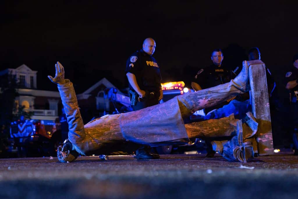 A statue of Confederate States President Jefferson Davis lies on the street after protesters pulled it down in Richmond, Virginia.