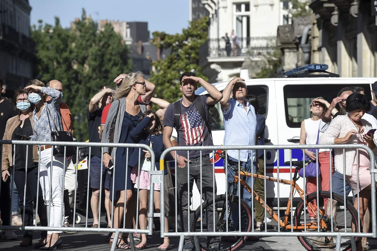 People watch as firefighters put out the blaze.