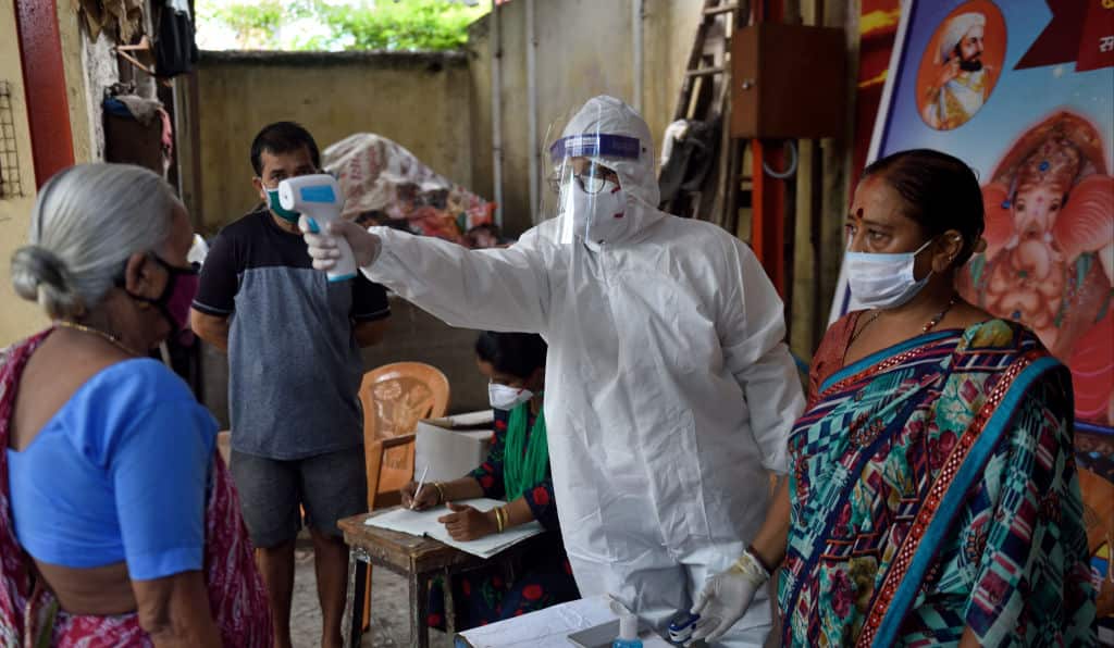 Temperature checks in the slums of India