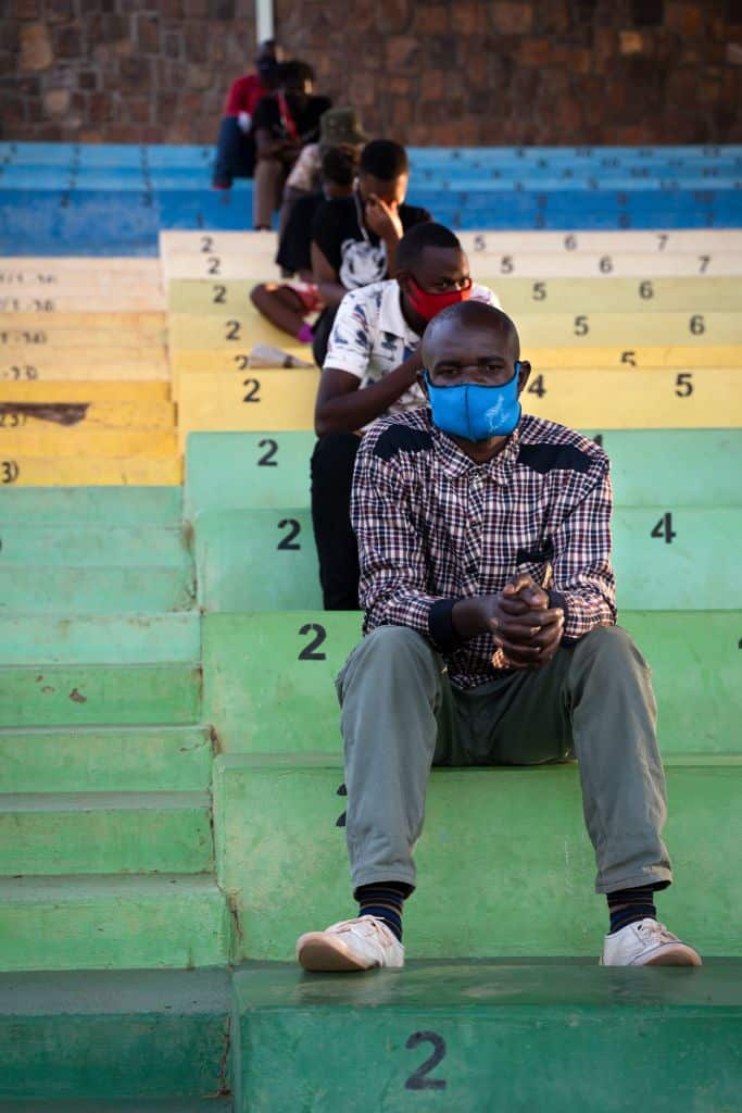 Offenders of Rwanda's coronavirus restrictions are forced to sit and listen the prevention speeches