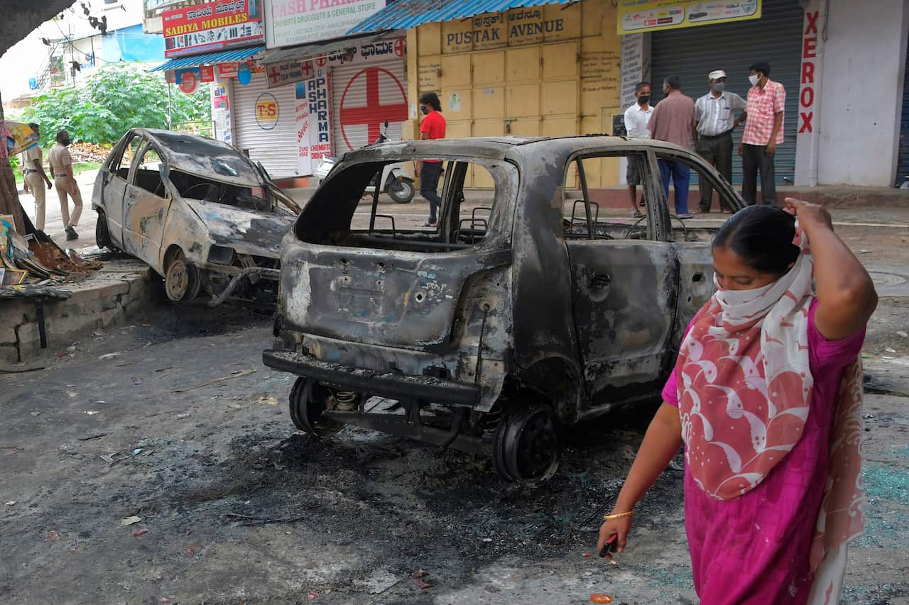 Two people died after a "derogatory" Facebook post about the Prophet Mohammed sparked riots in India's Bangalore that saw clashes between police and protesters.