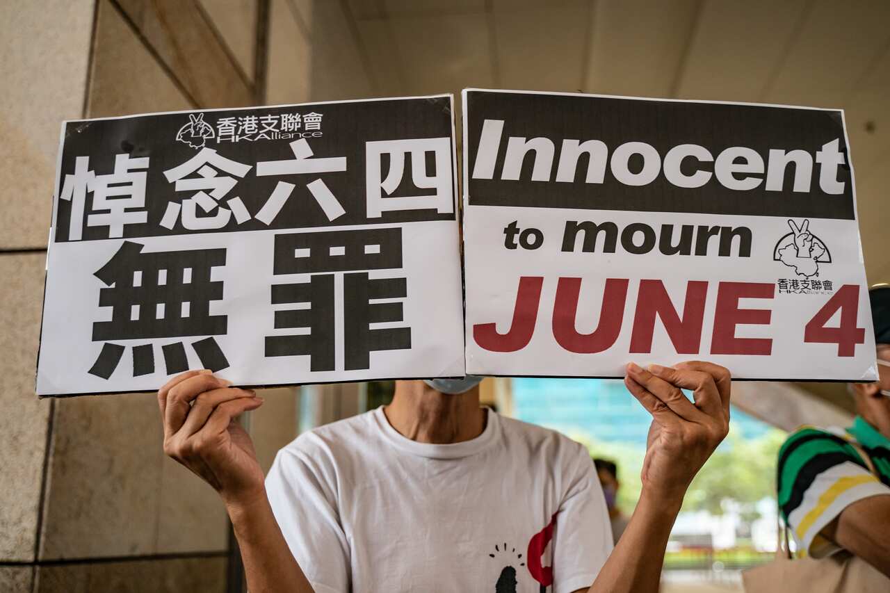 Two dozen Hong Kong activists have appeared in court over a banned Tiananmen vigil.