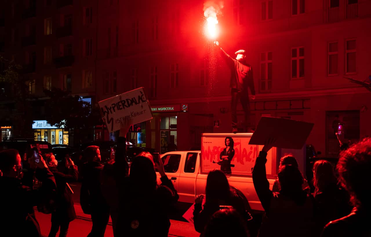 People protest a recent ruling by the Constitutional Tribunal resulting in a near-total ban of abortions in Warsaw, Poland, on 26 October.