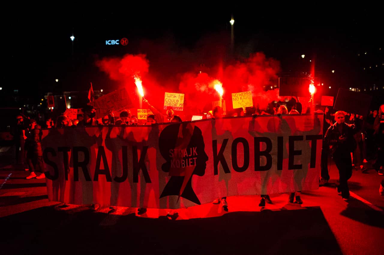 People protest in Warsaw, Poland, on 26 October.