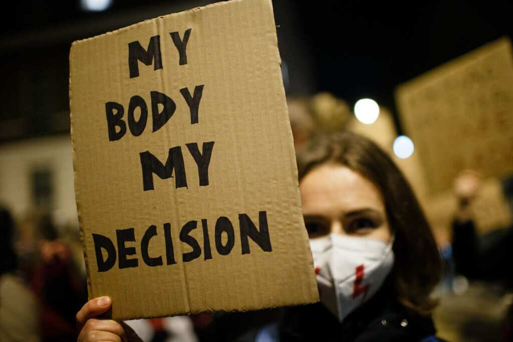 Opponents of Poland's new abortion restrictions demonstrate outside the Polish Embassy on Portland Place in London.