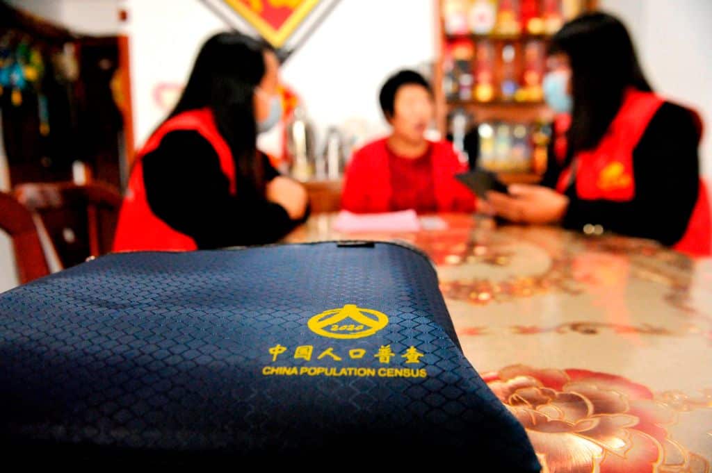 Census workers collect information from a resident in Qingdao, in China's eastern Shandong province.
