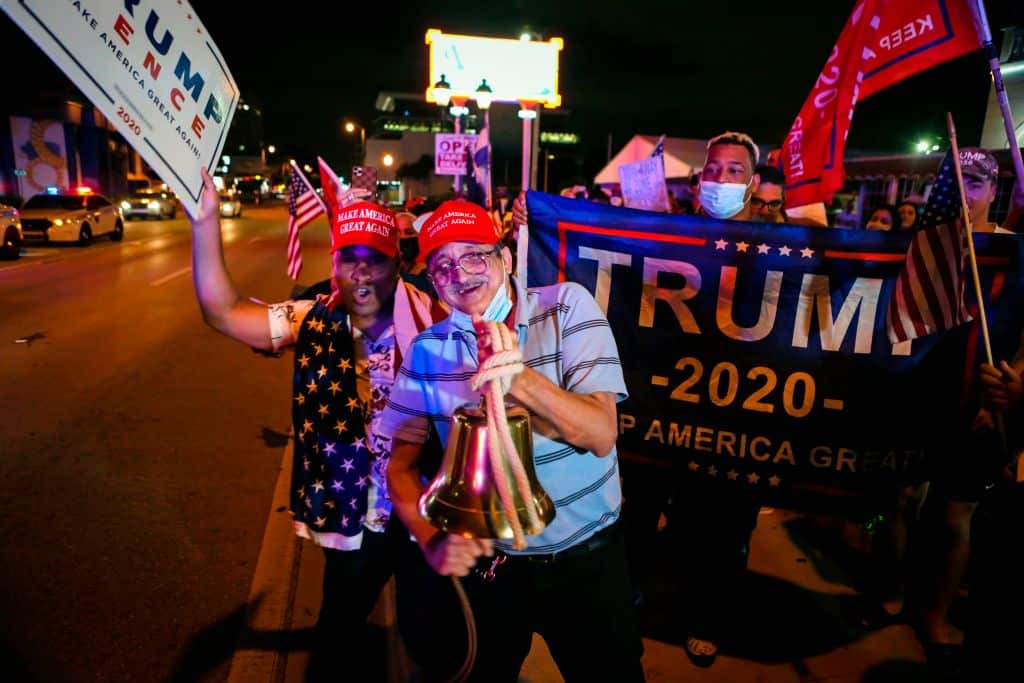 Supporters of US President Donald Trump rally in front of Cuban restaurant Versailles in Miami, Florida on early November 4, 2020. (Photo by Eva Marie UZCATEGUI / AFP) (Photo by EVA MARIE UZCATEGUI/AFP via Getty Images)