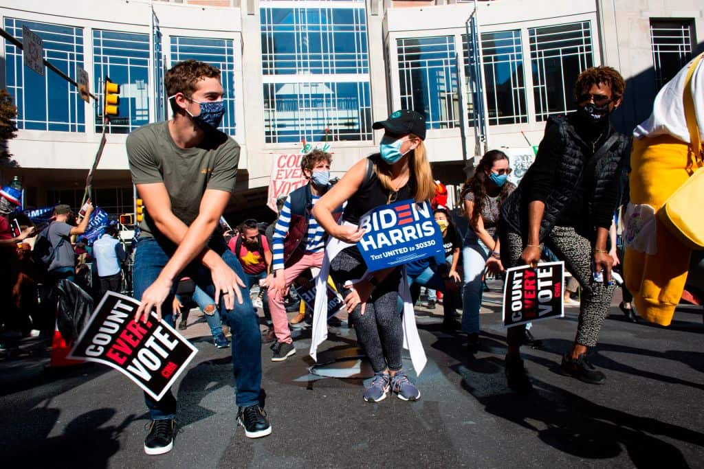 Demonstrators dance as they protest outside the Pennsylvania Convention Center on 5 November in Philadelphia. 