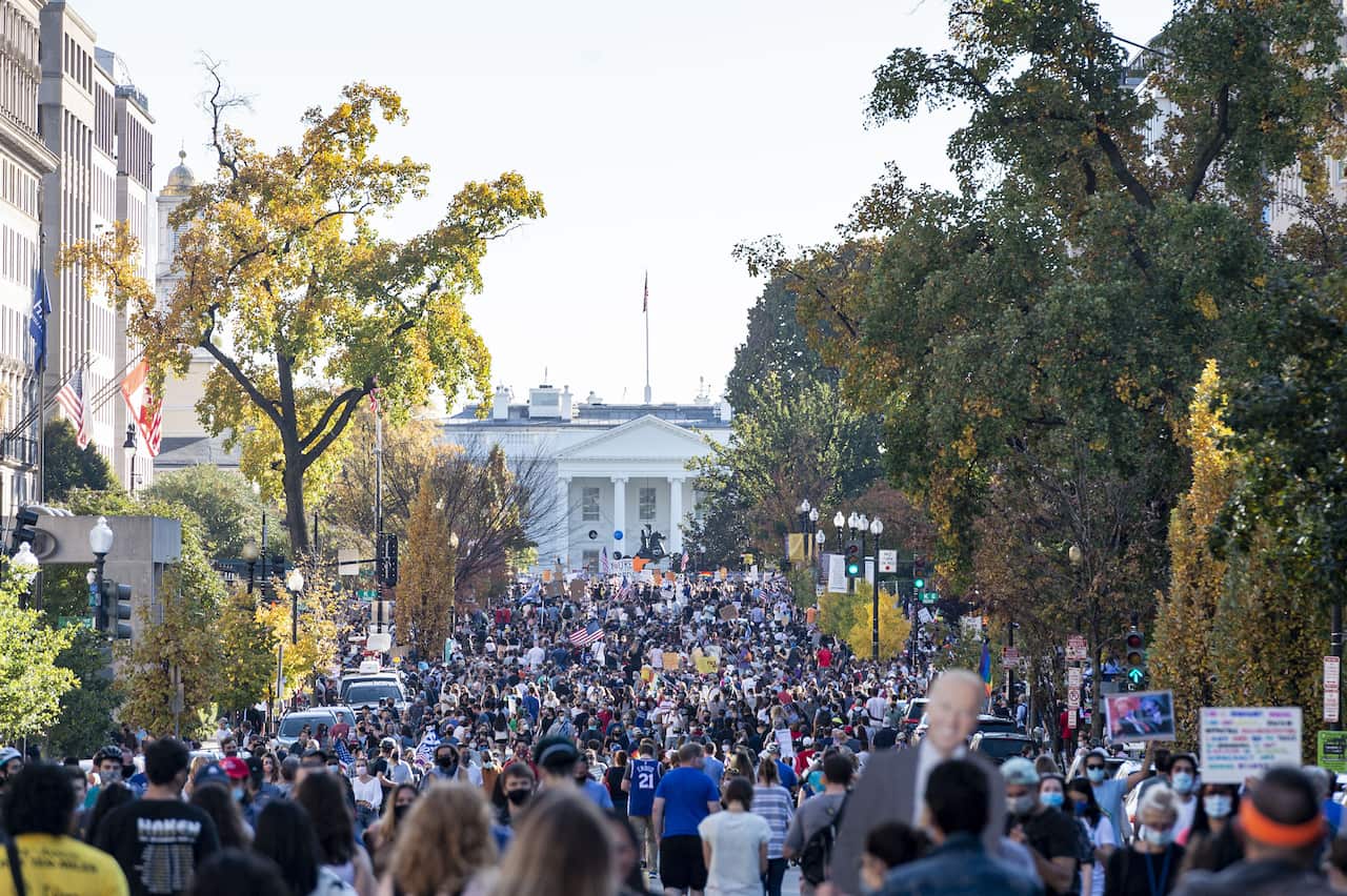 Joe Biden supporters gather to celebrate the victory in front of the White House in Washington.