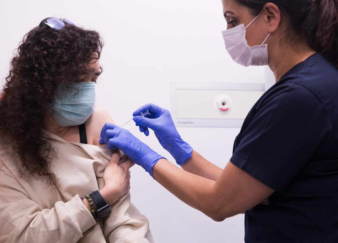 A volunteer is vaccinated during trials of a COVID-19 vaccine developed by China at a hospital in Ankara, Turkey on 23 November.