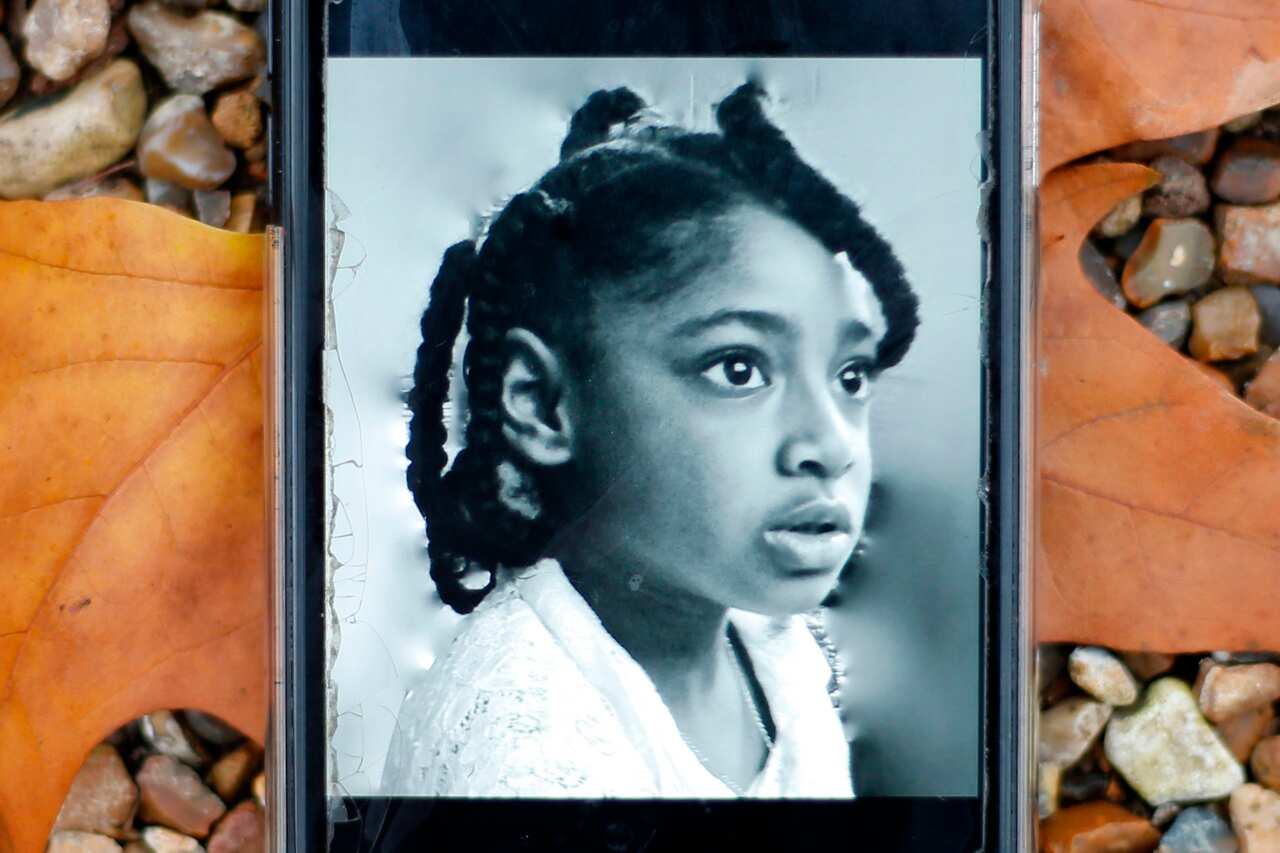A mobile phone displaying a photograph of Ella Adoo-Kissi-Debrah.