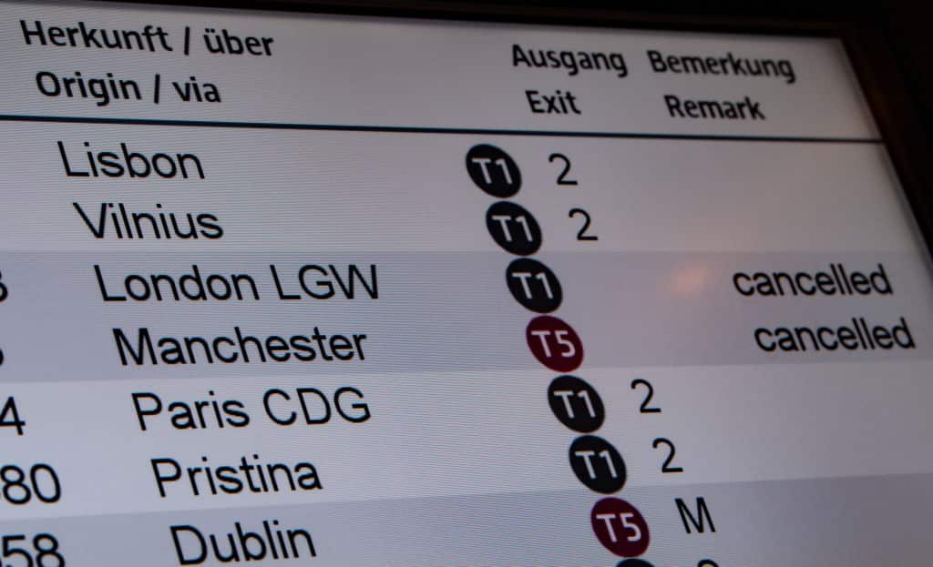 The information board at Berlin Airport, Germany shows flights from the UK are cancelled.