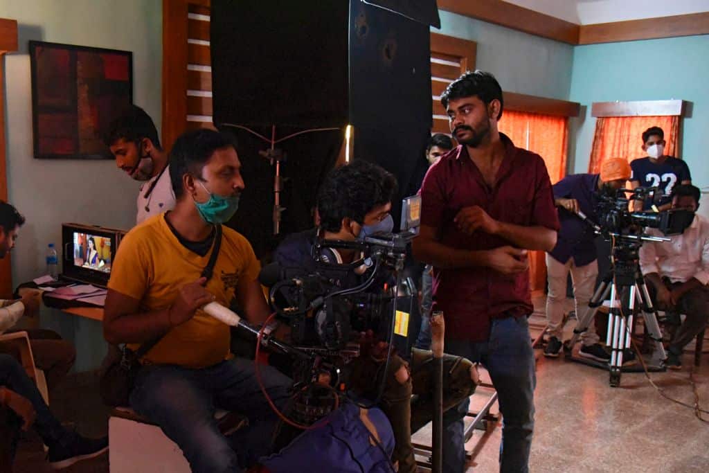 In this photograph taken on November 21, 2020, a camera crew works on a Bollywood film set on Madh Island off the coast of Mumbai.