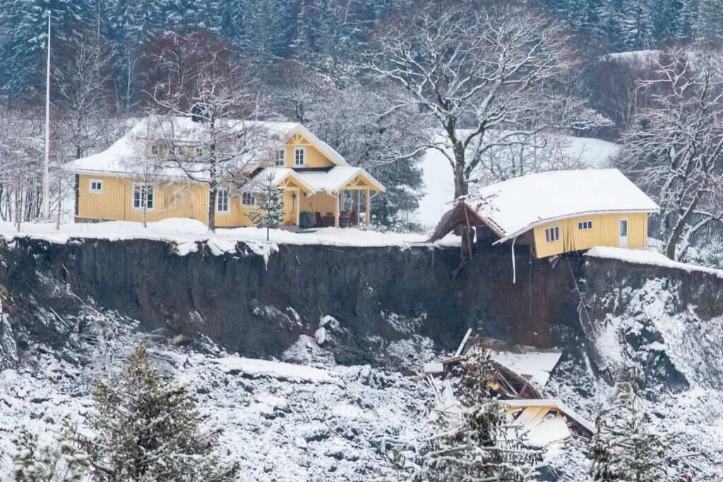 A damaged house is seen at a landslide area in Ask, Norway.