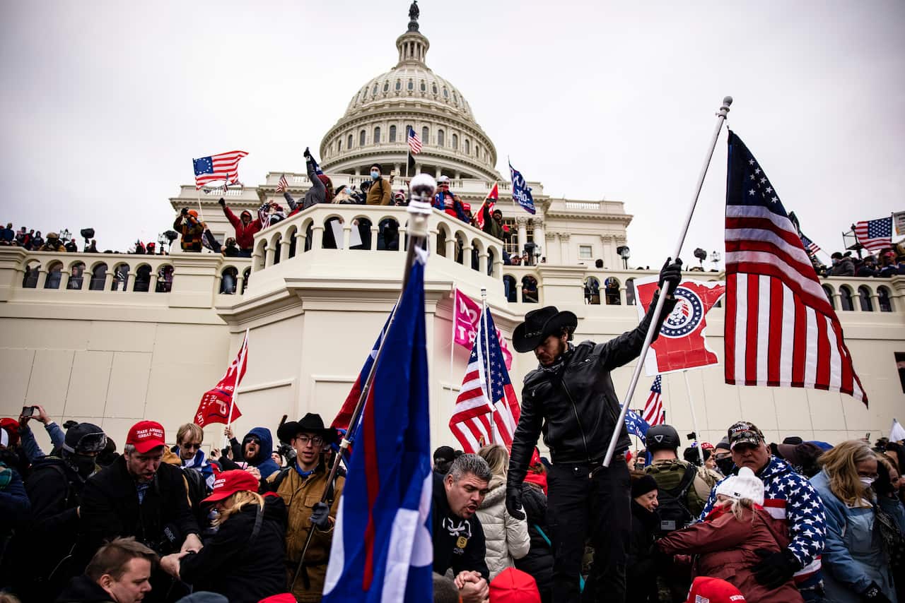 Pro-Trump supporters storm the US Capitol following a rally with then-president Donald Trump on 6 January, 2021 in Washington, DC.