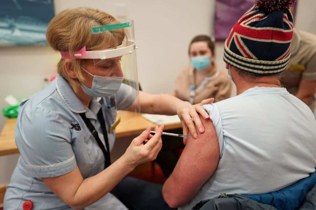 A key worker receives the coronavirus vaccine in Newcastle Upon Tyne, northern England.