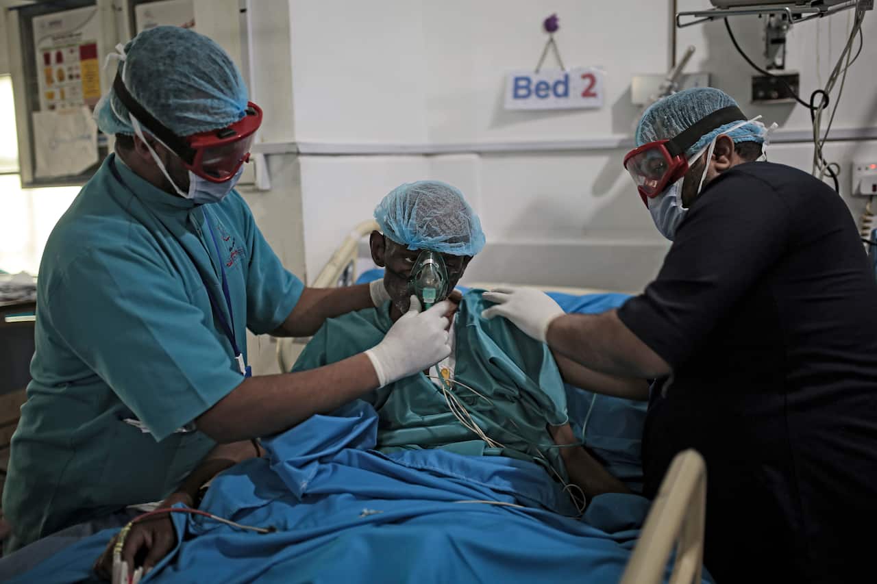 Medics attend to a patient at a hospital in Sanaa in January.
