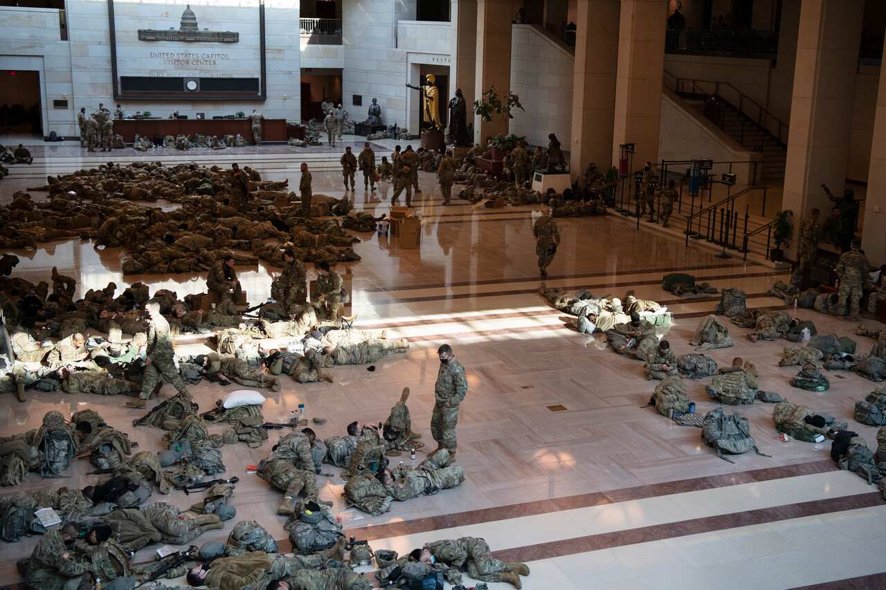 Photographs are going viral of National Guard troops keeping watch over the Capitol.