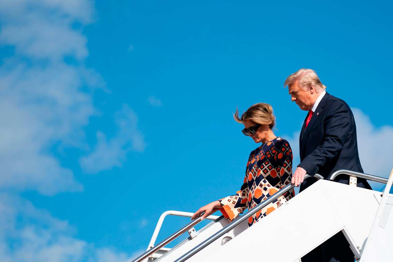 Outgoing US President Donald Trump and First Lady Melania Trump arrive at Palm Beach International Airport in Florida, on 20 January.