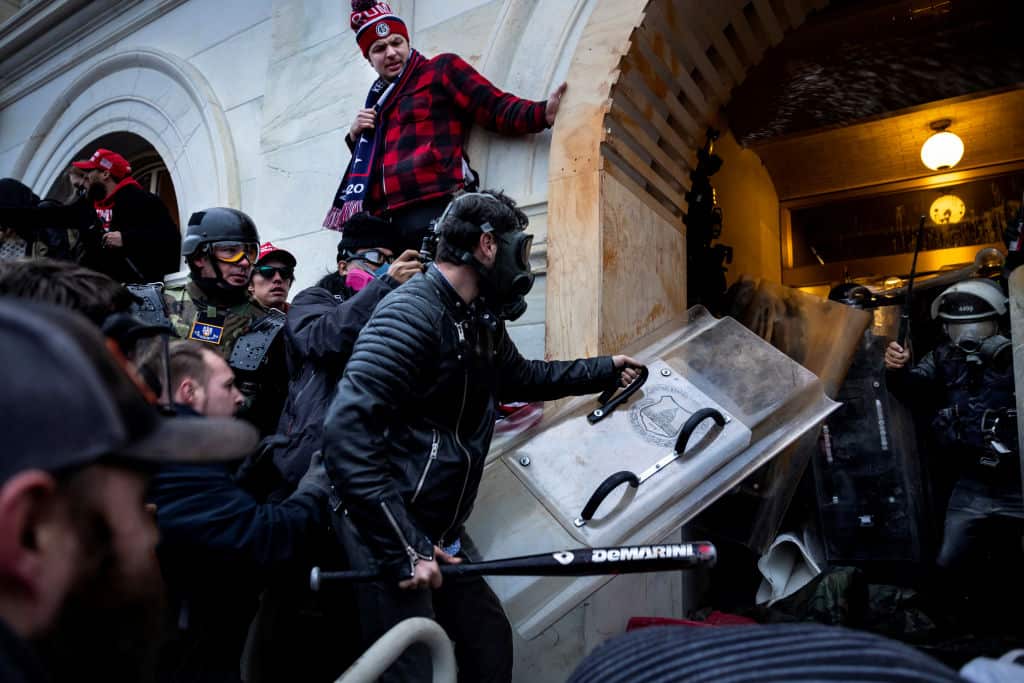 Trump supporters clash with police and security forces as people try to storm the US Capitol in Washington DC on 6 January, 2021.