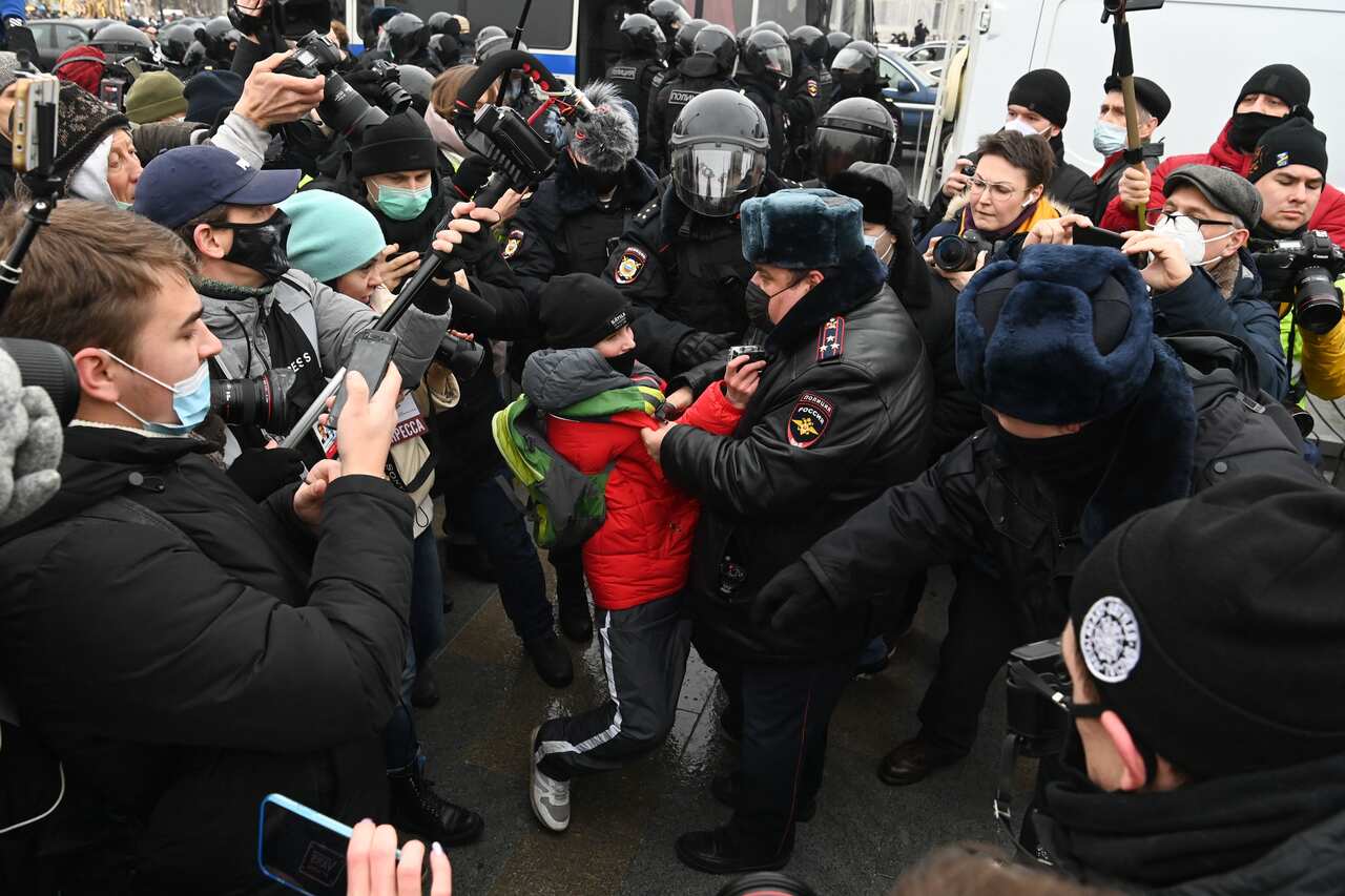 Police detain a boy during a rally in support of jailed opposition leader Alexei Navalny in downtown Moscow on 23 January, 2021. 