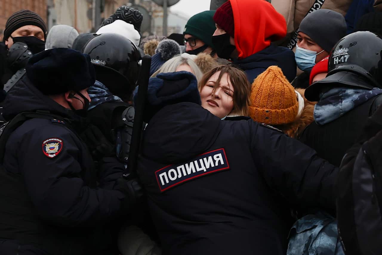 Police officers block the road during a protest demanding the release of Russian opposition figure Alexei Navalny in Moscow on 23 January.