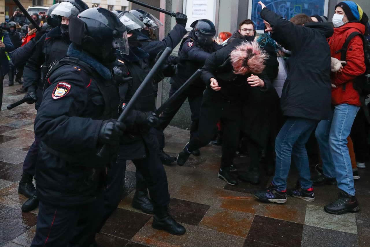 Riot police and protesters clash in Moscow on 23 January.