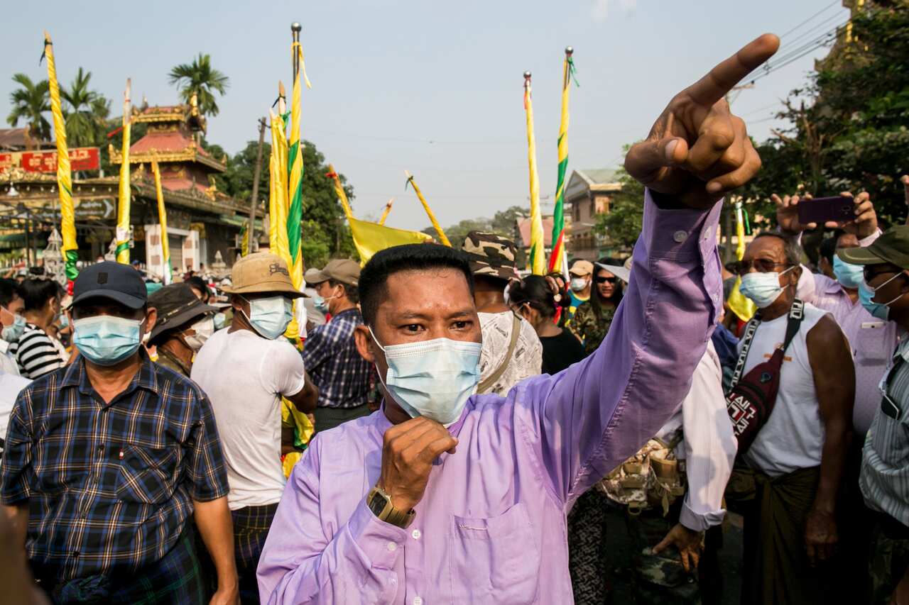 Military supporters take part in a protest to demand an inquiry to investigate the Union Election Commission (UEC) in Yangon on January 29, 2021.