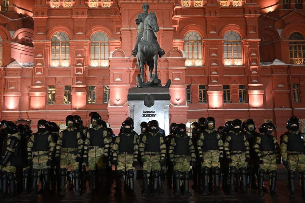 Law enforcement officers stand guard in front of a monument to Soviet Marshal Georgy Zhukov outside Red Square in Moscow on 2 February. 