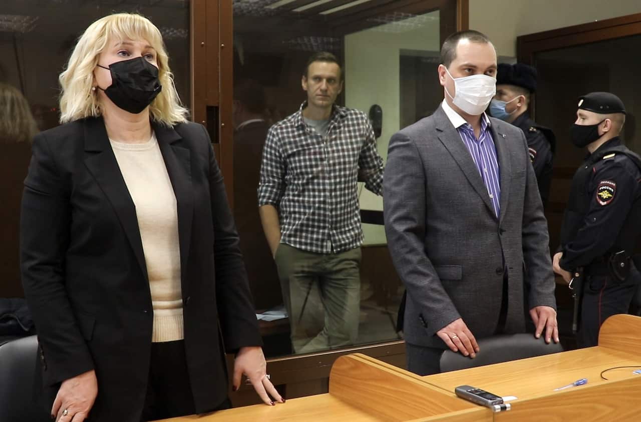 Russian opposition activist Alexei Navalny and his lawyers Olga Mikhailova and Vadim Kobzev during an offsite hearing of the Moscow City Court on 20 February.