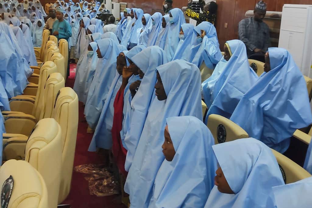 A group of girls previously kidnapped from their boarding school in northern Nigeria arrive on government premises after their release.