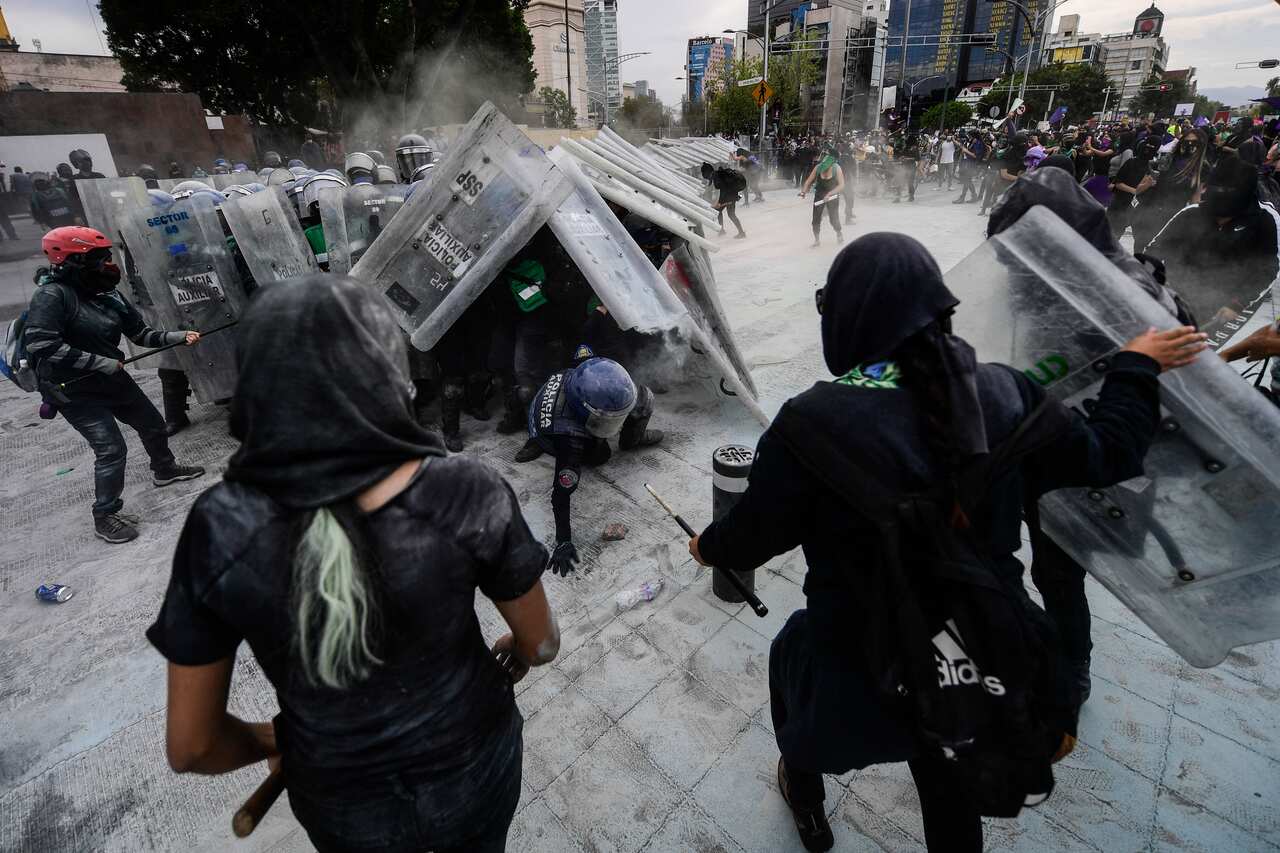 Protesters clash with the police during a demonstration to commemorate the International Women's Day in Mexico City.