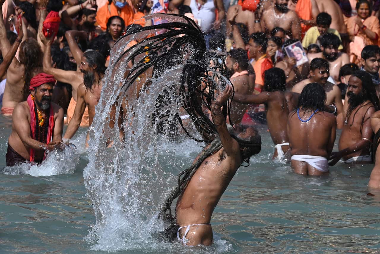 Naga Sadhus (Hindu holy men) dip in the River Ganges on Maha Shivratri during the ongoing religious Kumbh Mela festival in Haridwar in 2021.